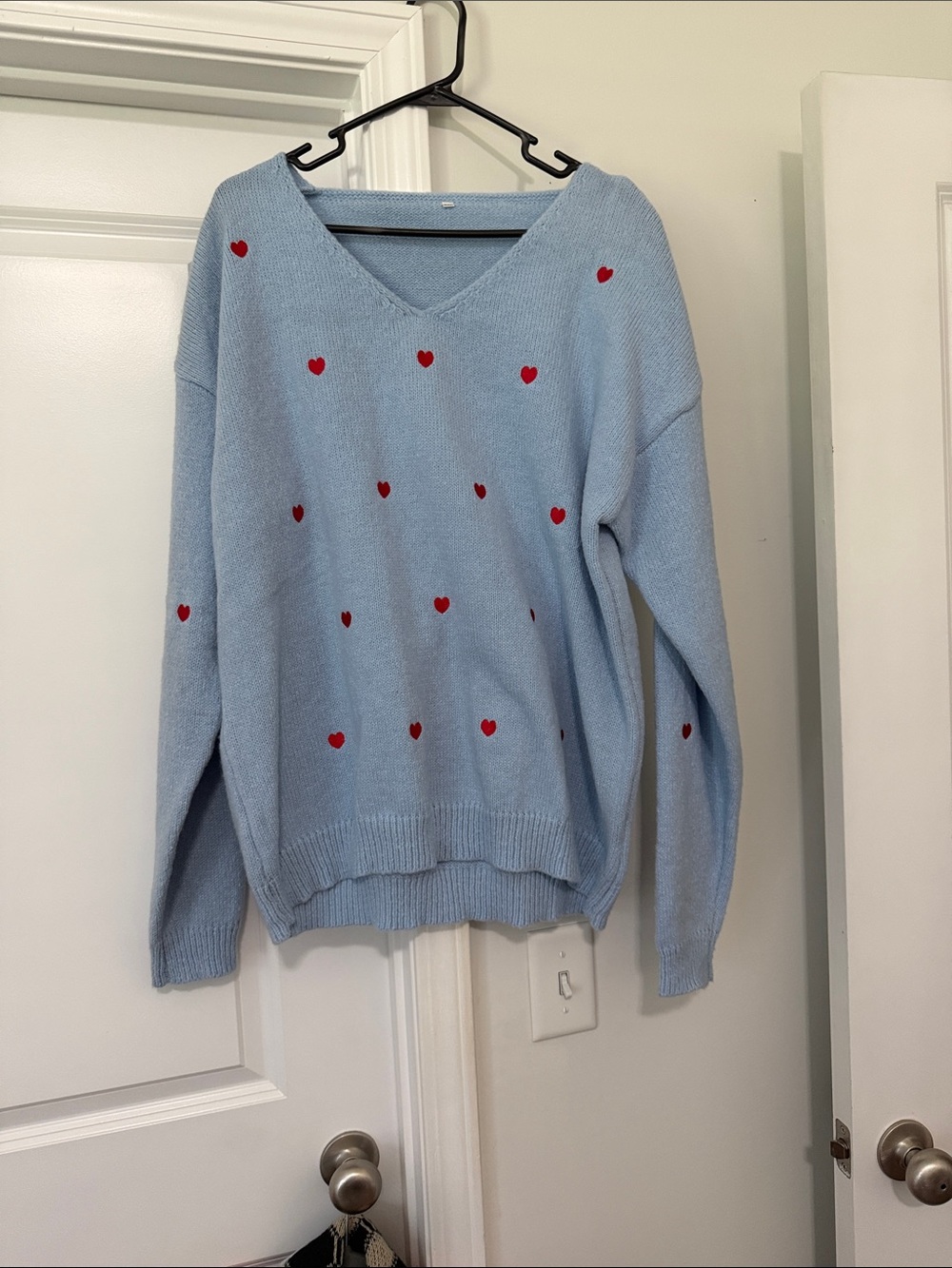 Amazon Light Blue V‑Neck Sweater with Red Heart Accents